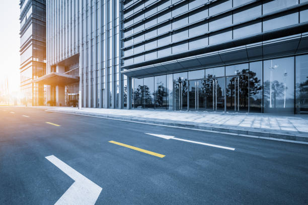 istock clean asphalt road through office block area,suzhou,china. 1301318146