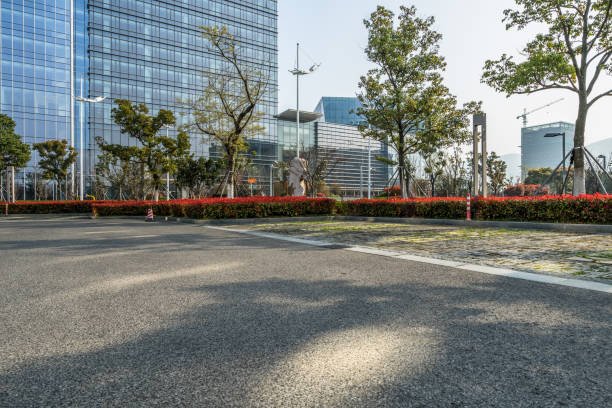 istock clean asphalt road through office block area,suzhou,china. 1301318159