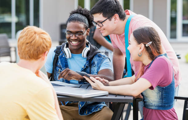istock High school students studying outdoors 1301318262