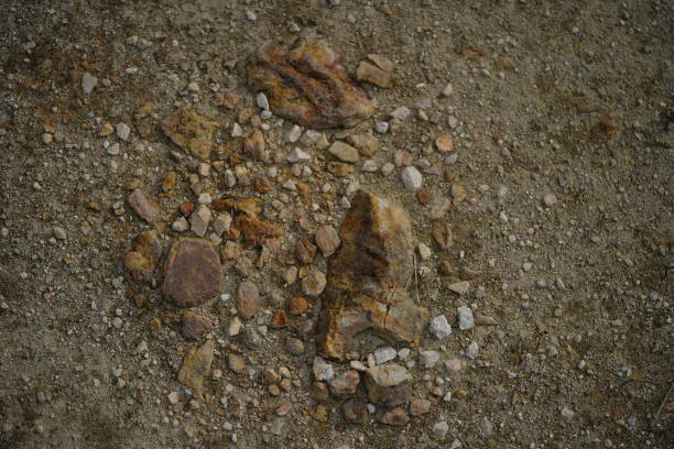 Sulphur rock with stone on the ground mixed up with sand