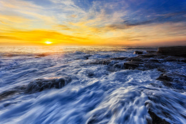 istock Sea TB Rocks dawn swift foam 1301326725