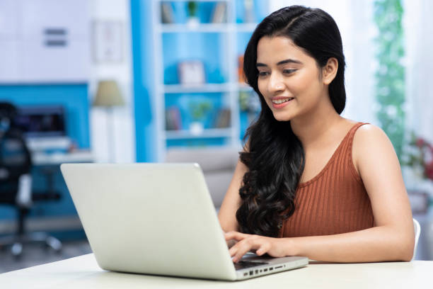istock young women using laptop at home 1301327357