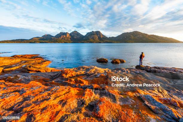 A Woman Enjoys A Sunset View Of The Hazards From Coles Bay Stock Photo - Download Image Now