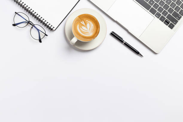 istock Top view, Workspace desk With coffee and office supplies on white background 1301333188