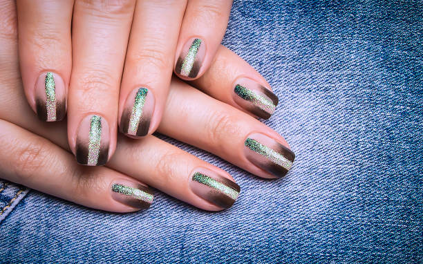 istock Female black manicure on a denim background. 1301339624