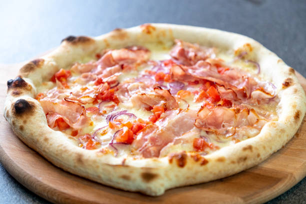 istock Baked pizza with bacon and mozzarella cheese 1301340617