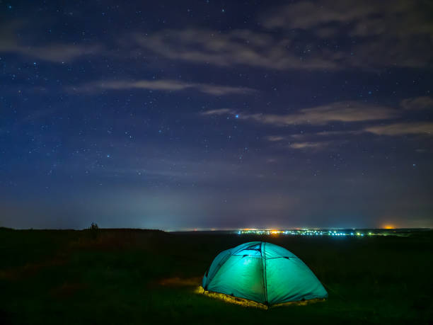 istock Green tent under stars sky 1301341686