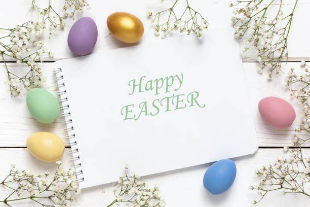 istock Easter background with colorful eggs and spring flowers on a white wooden background. Top view with copy space, mockup 1301344065