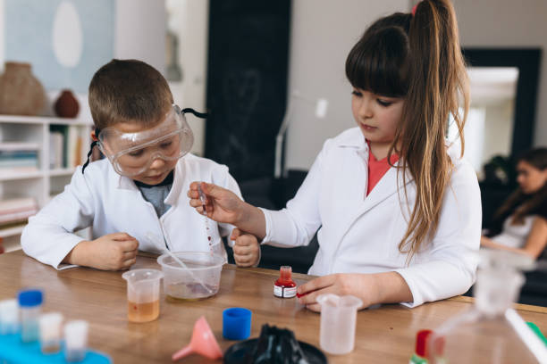 istock brother and sister do science experiments at home 1301345019