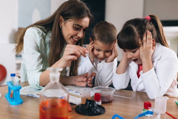 istock brother and sister do science experiments at home 1301345039