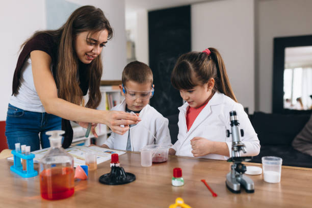 istock brother and sister do science experiments at home 1301345200