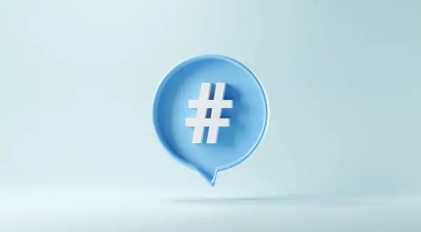 Photo of Hashtag sign symbol in social media notification icon on pastel blue background.
