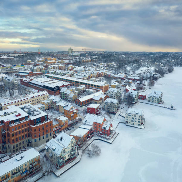 istock Residential area by a lake in winter 1301346343