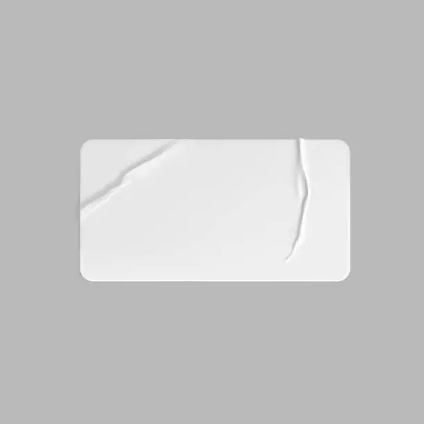 Vector illustration of White glued crumpled rectangle sticker mock up. Blank white adhesive paper or plastic sticker label with wrinkled and creased effect. Template label tag close up. 3d realistic vector