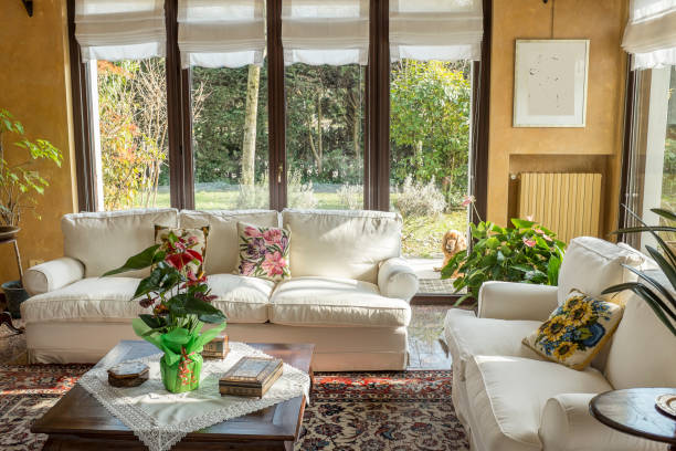 istock living room with a sofa and big windows 1301351793