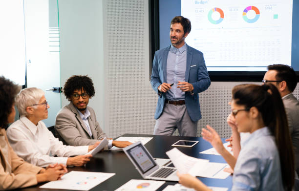 istock Happy diverse business colleagues meeting, working in modern office 1301351861