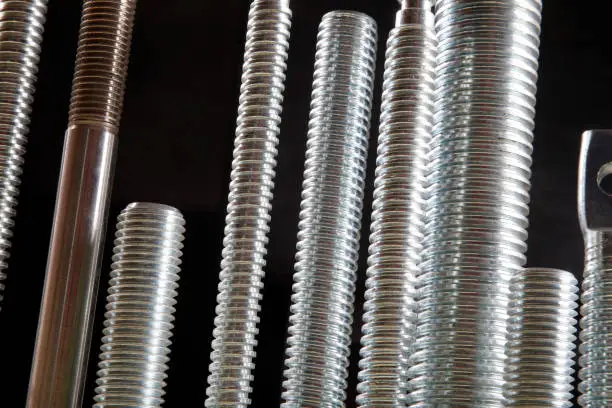 Photo of Newly manufactured large screws. Close up.