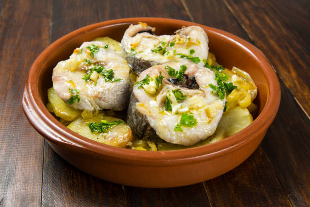 Baked hake Baked hake with potatoes, Mediterranean food hake stock pictures, royalty-free photos & images