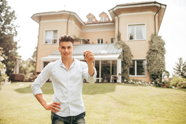 istock real estate agent in front of a property 1301358476