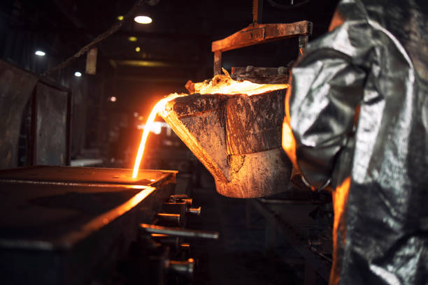 istock An unrecognizable foundry worker filling casting molds with hot molten iron. Steel production and metallurgy. 1301361303