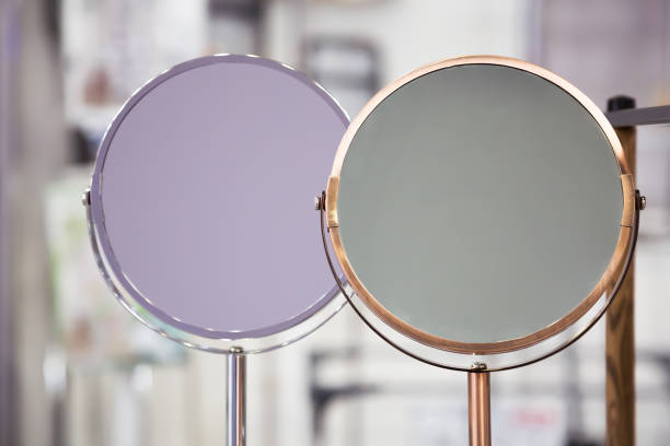 istock Two cosmetic mirrors without close-up reflection, personal care accessories 1301362113