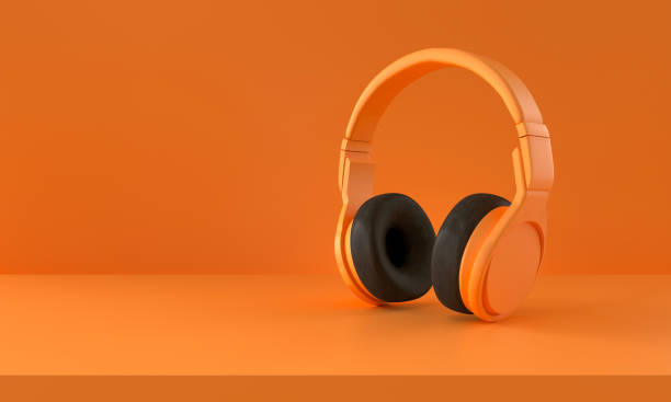 istock Orange Headphones on orange Background. Minimalism concept. 1301369294