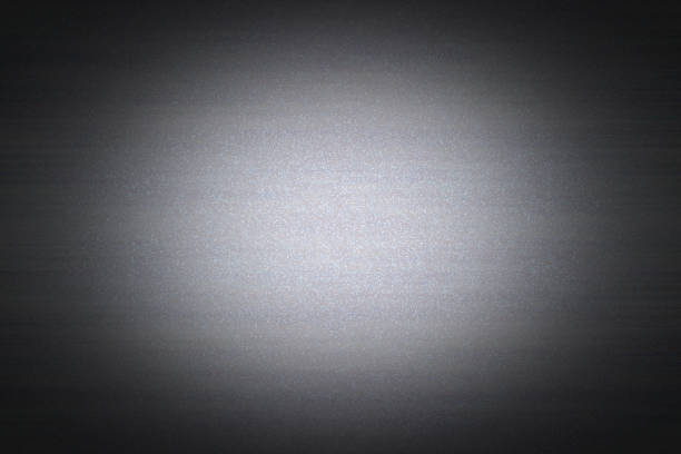 Grey background with faceted grain and darkened edges