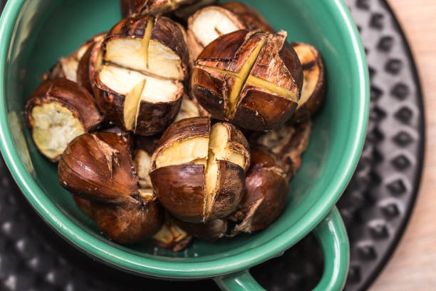 istock Edible roasted chestnuts in a green bowl 1301370703