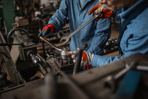 istock Two metal workers working together in metal industry 1301370798