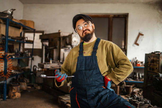 istock Male metal worker holding wrench 1301371165