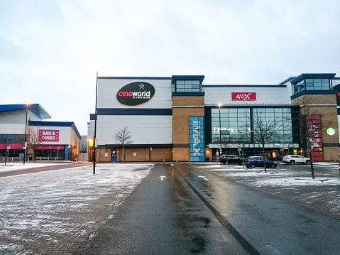 Crawley, UK - 8 February, 2021: Exterior architecture of a deserted Cineworld multi screen cinema in Crawley, a town in southeast England. It is during the coronavirus lockdown and the cinema is closed to the public.