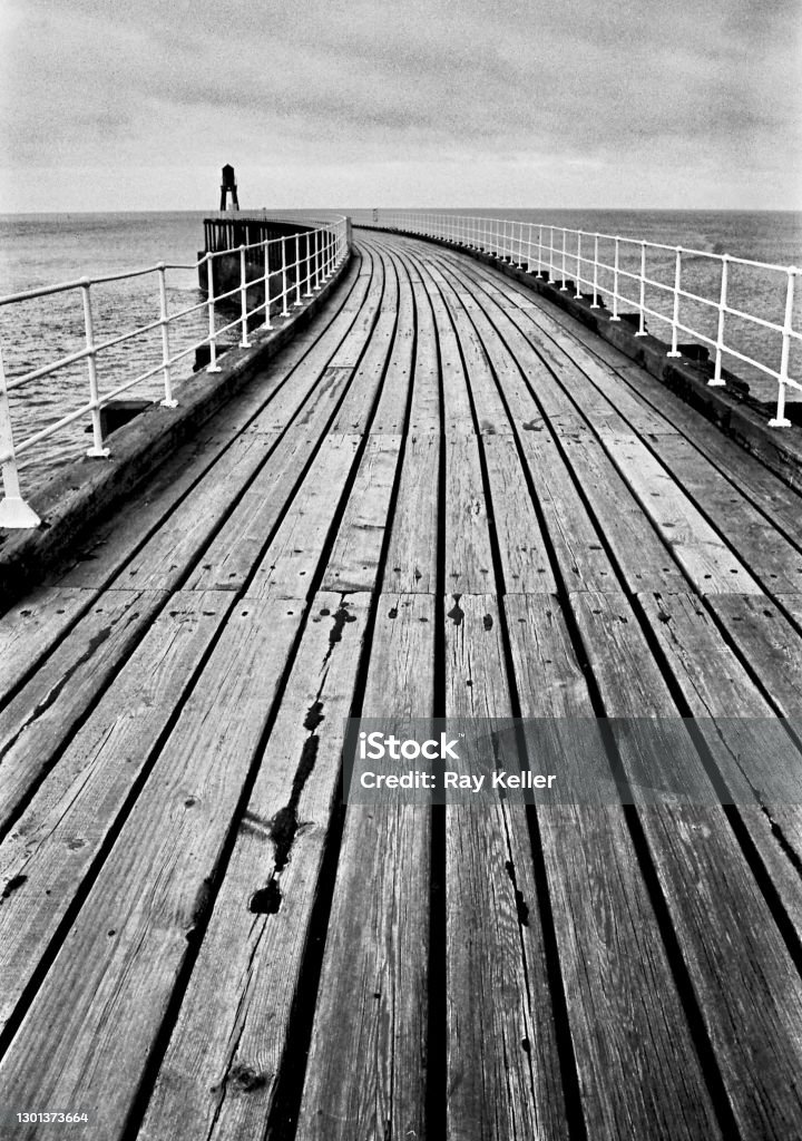 Wood grain Old wooden pier at Whitby. North Yorkshire. Film camera. 35mm black and white film. Abstract Stock Photo