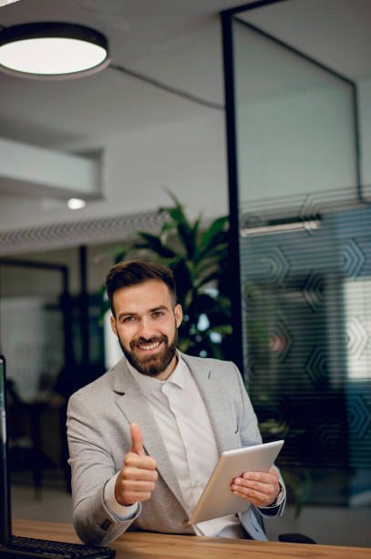 istock Young businessman working at office 1301374072