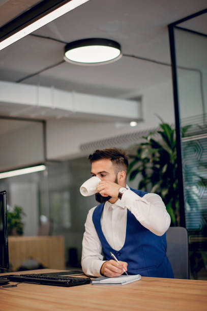 istock Young businessman working at office 1301374997