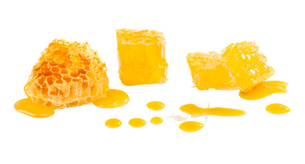istock Honeycomb and honey drops 1301375130
