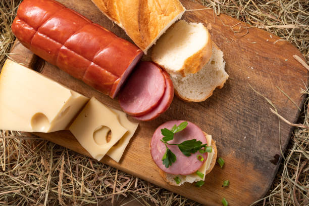 istock Slicing for a sandwich on a cutting board. View from above. Rustic stele. 1301377725