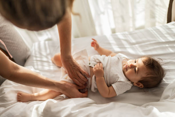 istock Mother taking care of baby 1301380904