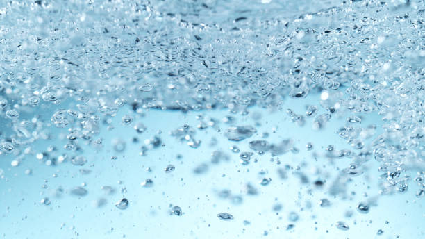 istock Detail of waving water with bubbles 1301381413