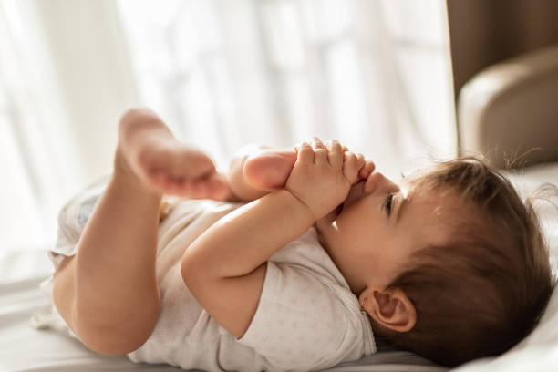 istock Beautiful baby on the bed 1301381421