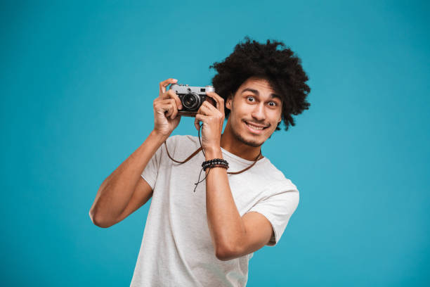 istock Handsome emotional young african curly man 1301381480