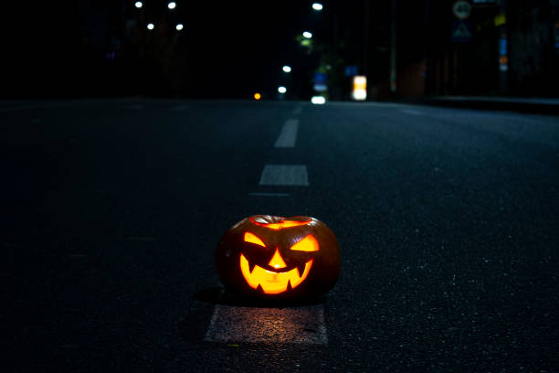 istock Halloween pumpkins with carved demonic faces 1301381737