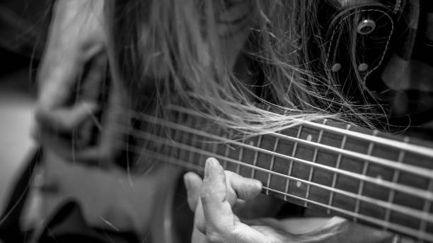 istock musician playing guitar black and white image, close up 1301383007