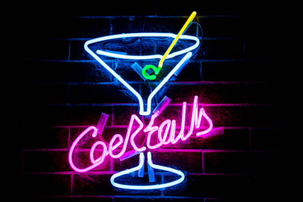 istock Glowing Purple Neon Inscription COCKTAILS 1301383058