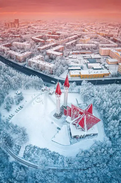 Photo of Aerial drone view of the famous landmark of Ufa and Bashkiria - Lala Tulip mosque during sunset in winter season. Islamic religion and muslim culture in Russia concept