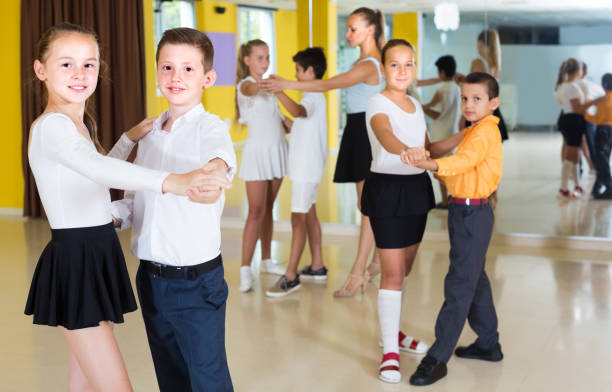 istock Pairs of children are dancing tango 1301386183