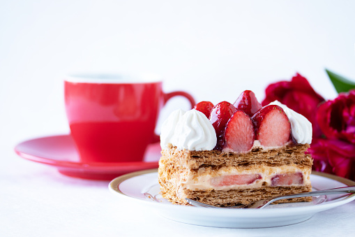 strawberry cake with coffee and flower