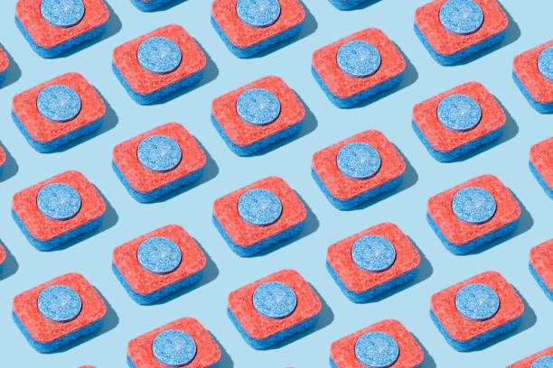 istock Minimal, modern dish washing pattern made of dishwasher tablets. Trendy bright flat lay. 1301394059