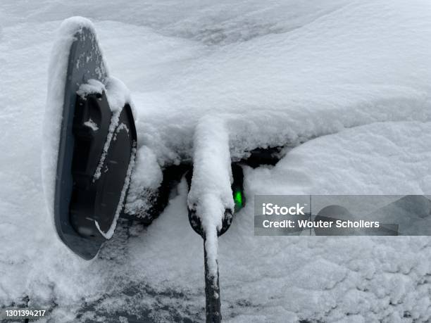 Electric Car Charging Stock Photo - Download Image Now - Electric Car, Winter, Snow