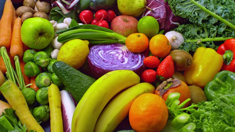 SLO MO LD A mix of fruits and veggies rotating on a platter