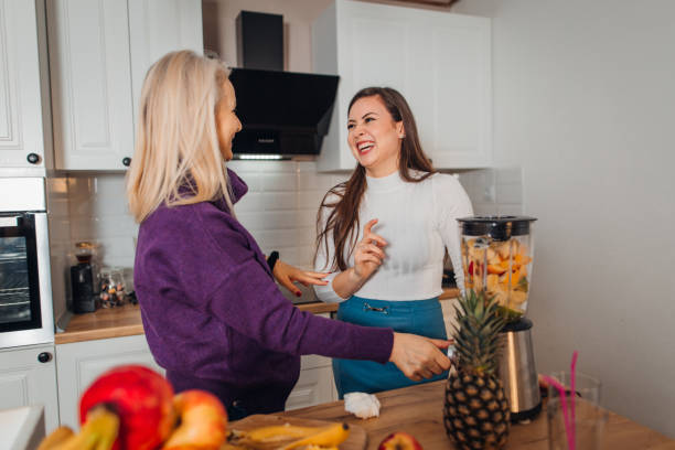 istock Mother and Daughter making smoothie 1301396885